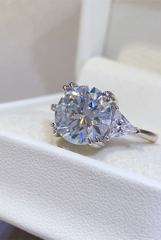 Hand showcasing a luxurious 5 carat Moissanite ring set in sterling silver