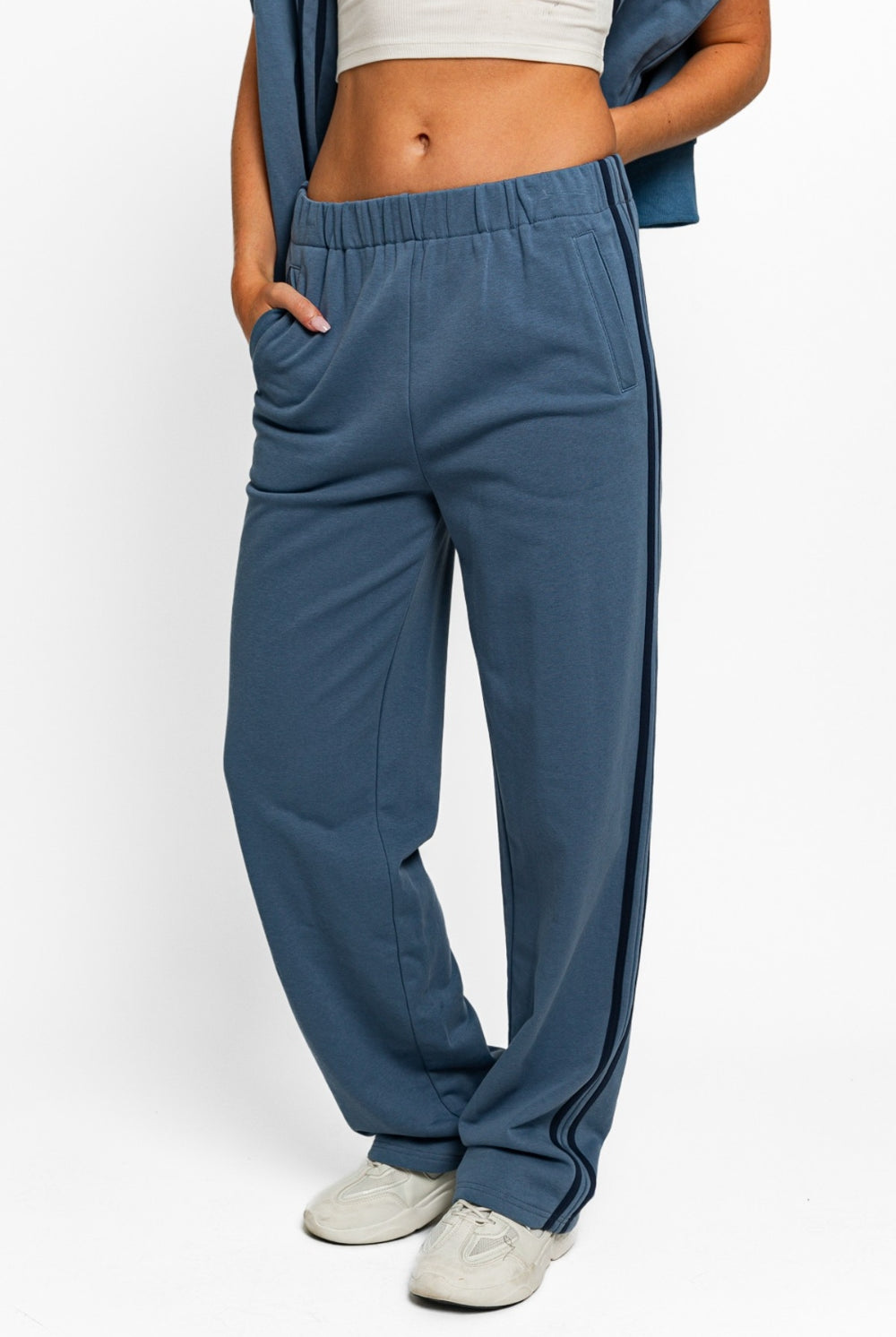 Model showcasing GemThreads Boutique's Side-Stripe Cozy Sweatpants in blue.