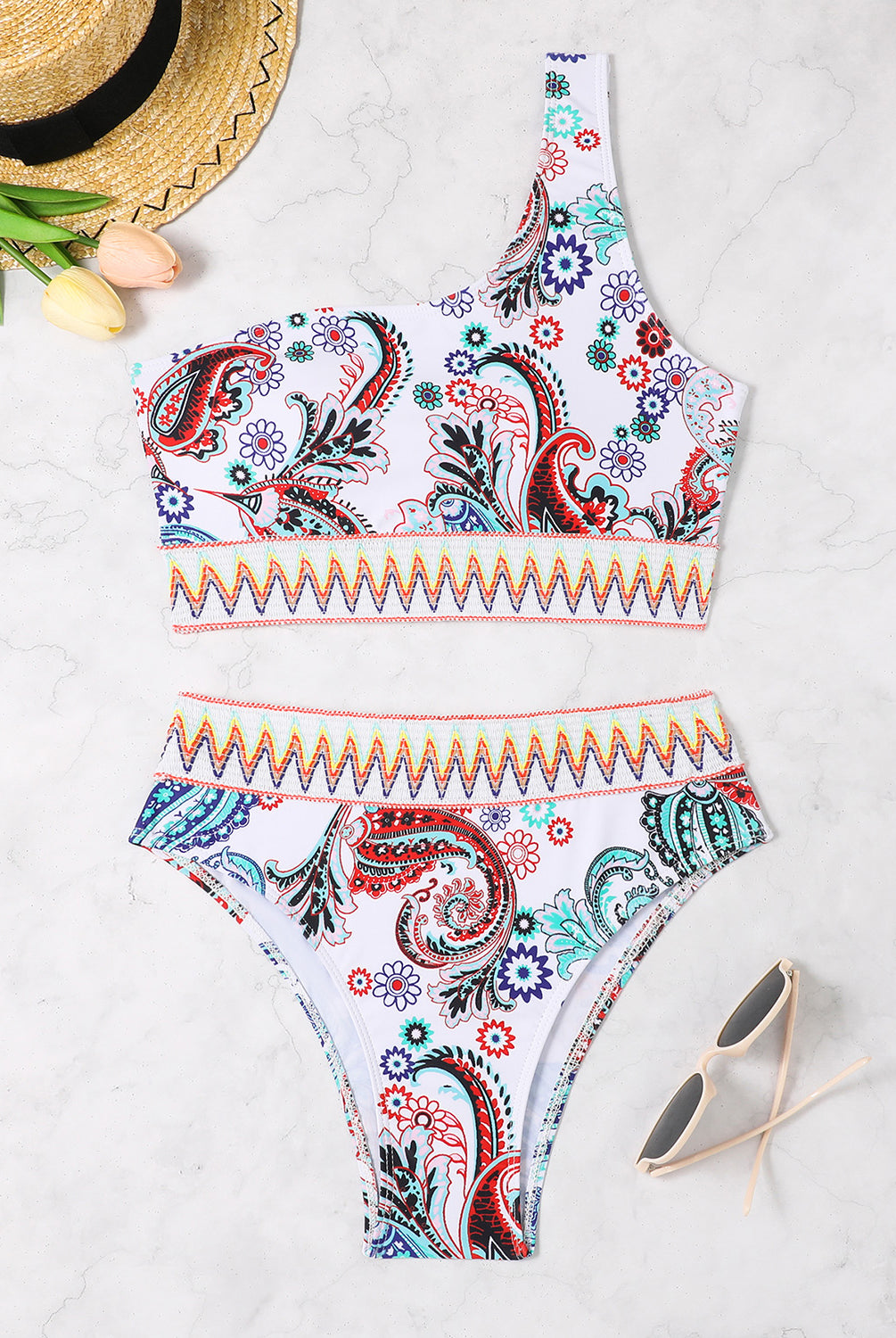 Woman in GemThreads Boutique one-shoulder printed two-piece white swim set