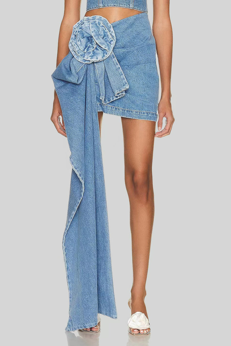 Trend-setting individual showcasing a unique denim skirt with an eye-catching asymmetrical cascading ruffle detail, making a bold fashion statement.