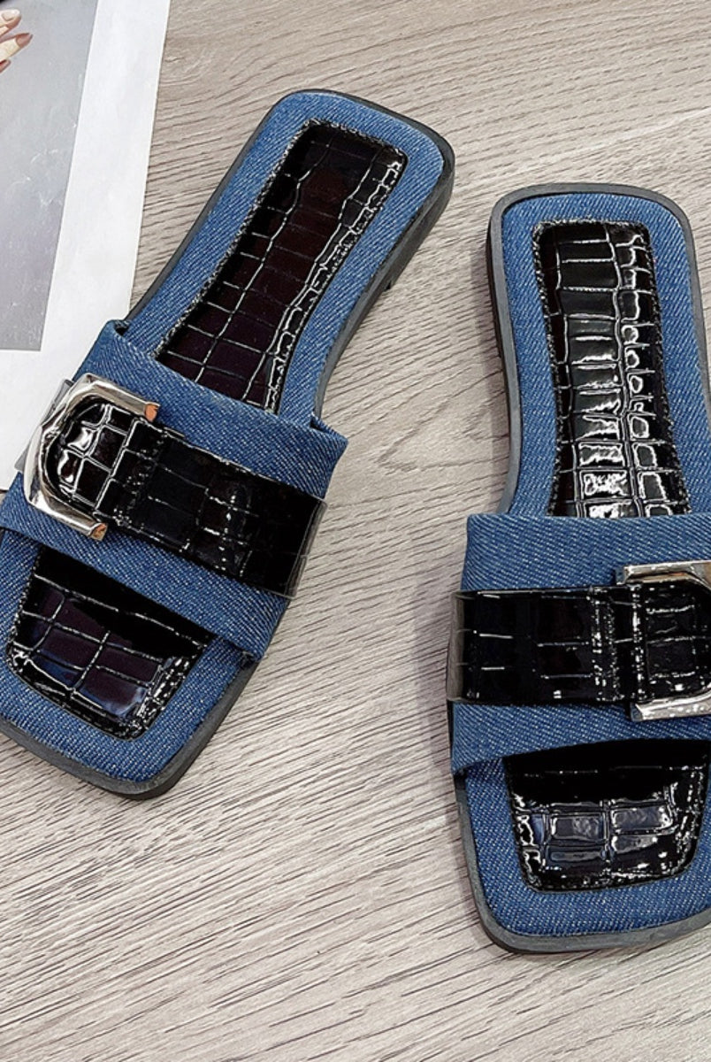 Trendy blue buckle sandals for women, showcasing a stylish open toe design for the summer season.