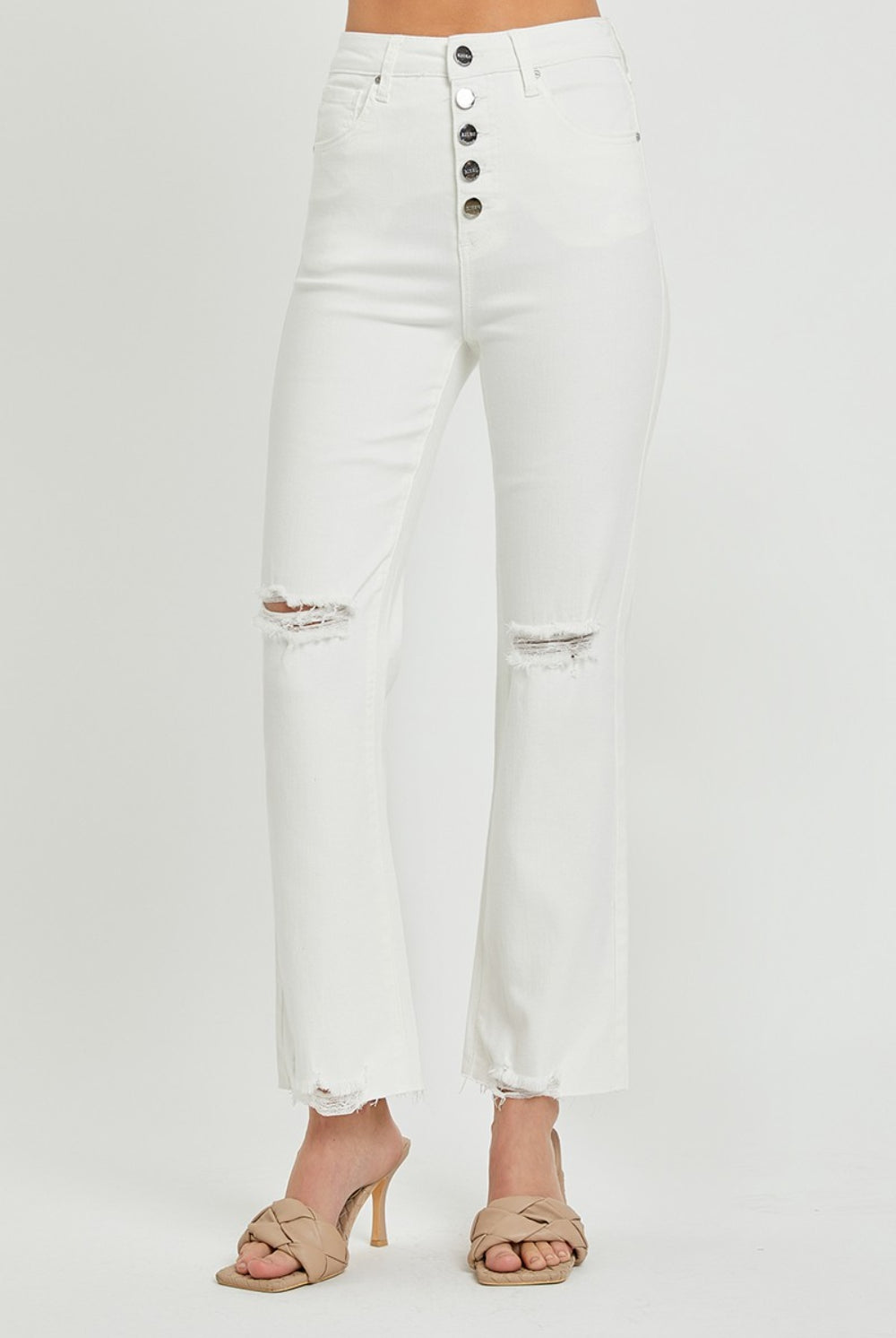 Model wearing GemThreads Boutique Distressed High-Rise Bootcut Jeans in white.
