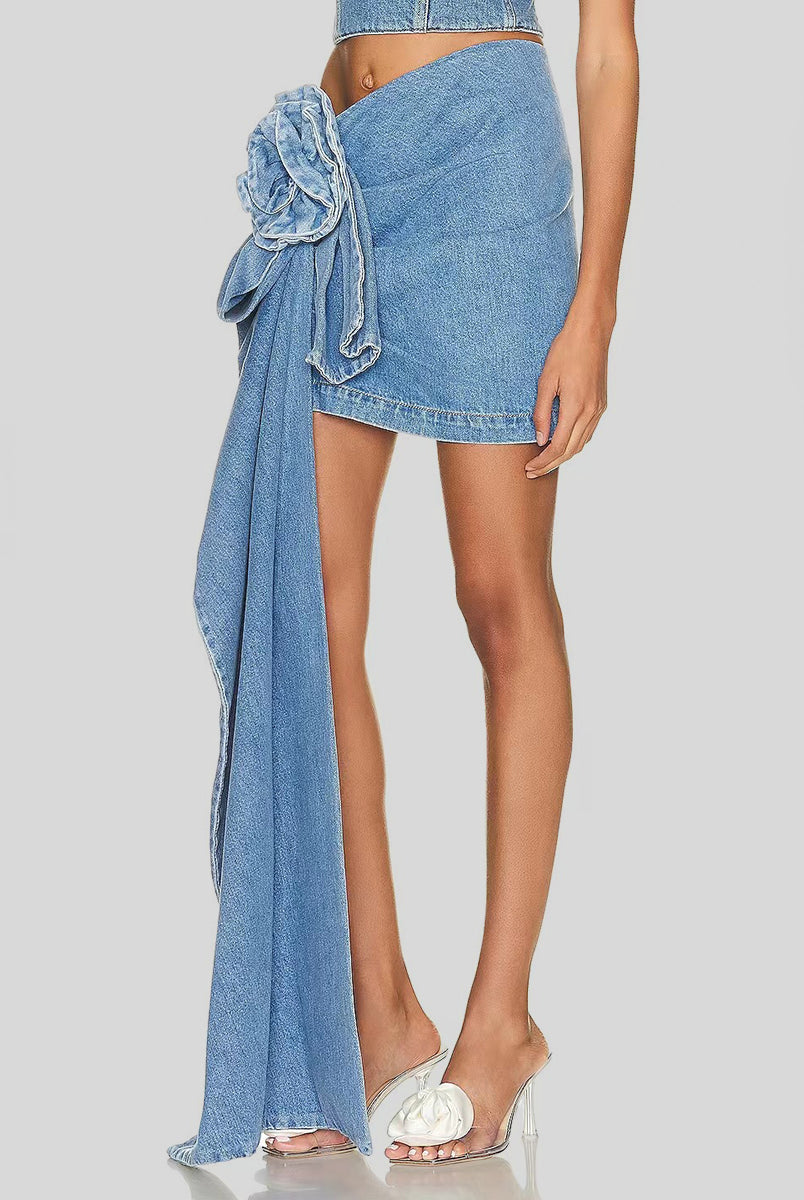 Trend-setting individual showcasing a unique denim skirt with an eye-catching asymmetrical cascading ruffle detail, making a bold fashion statement.