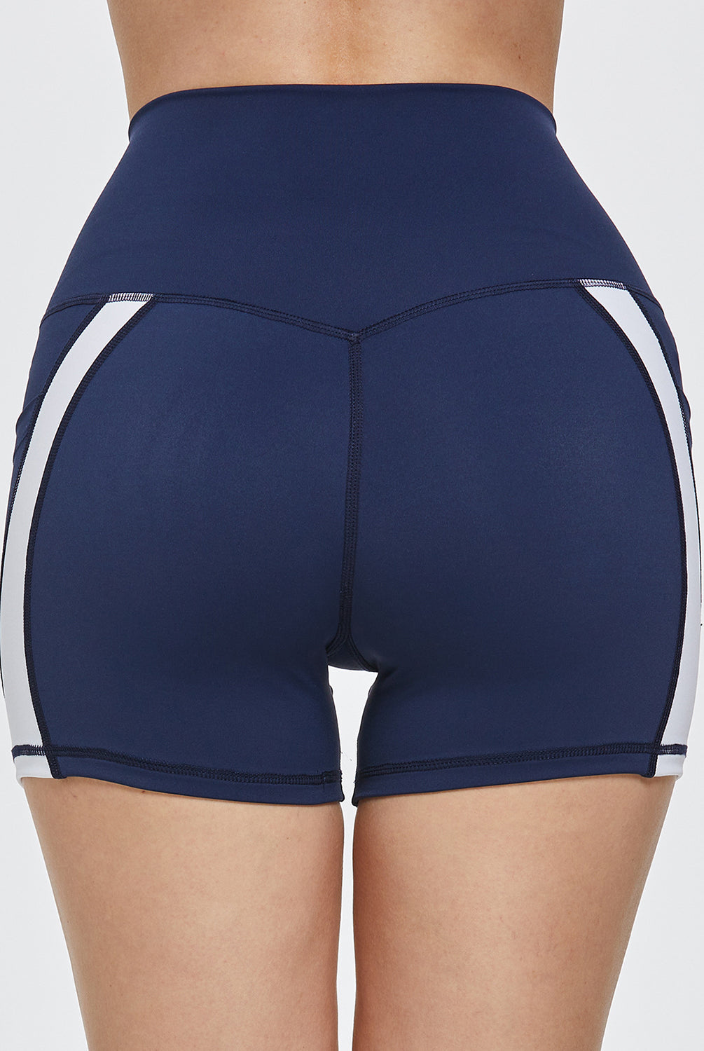 Athlete in dynamic active shorts featuring a practical pocket, ready for a workout session.