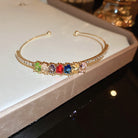Elegant rhinestone bracelet cuff displaying a rainbow of colors, perfect for adding a sparkling touch to any outfit.