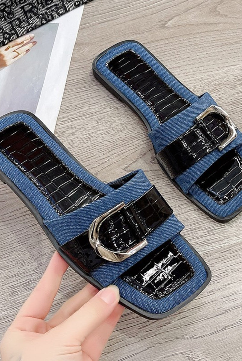 Trendy blue buckle sandals for women, showcasing a stylish open toe design for the summer season.