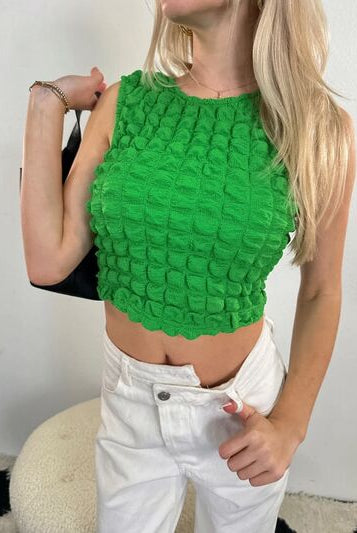 Round neck cropped tank top with a textured pattern, perfect for a stylish, modern look.
