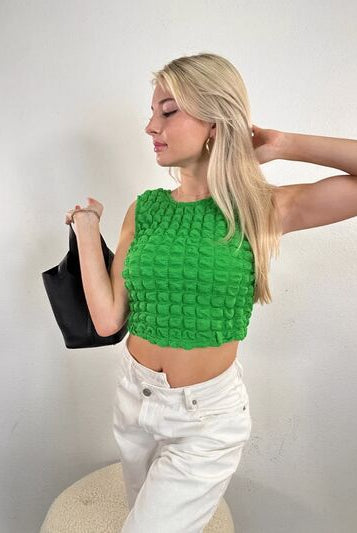 Round neck cropped tank top with a textured pattern, perfect for a stylish, modern look.