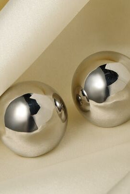 Elegant metallic spherical earrings showcased in both silver and gold, offering a polished and versatile accessory option.