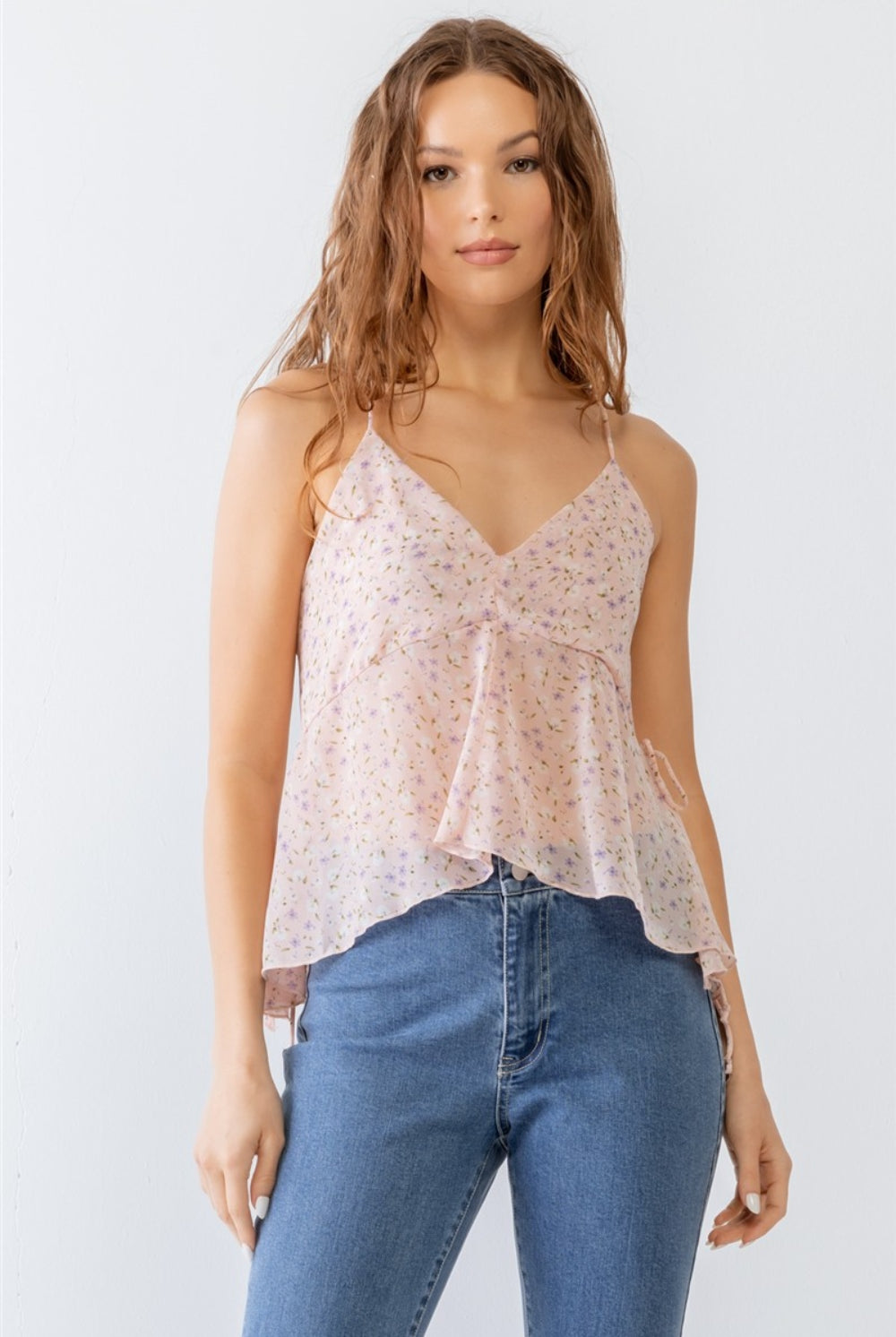 Elegant model wearing a light and airy lavender floral camisole top, ideal for a fresh spring look.