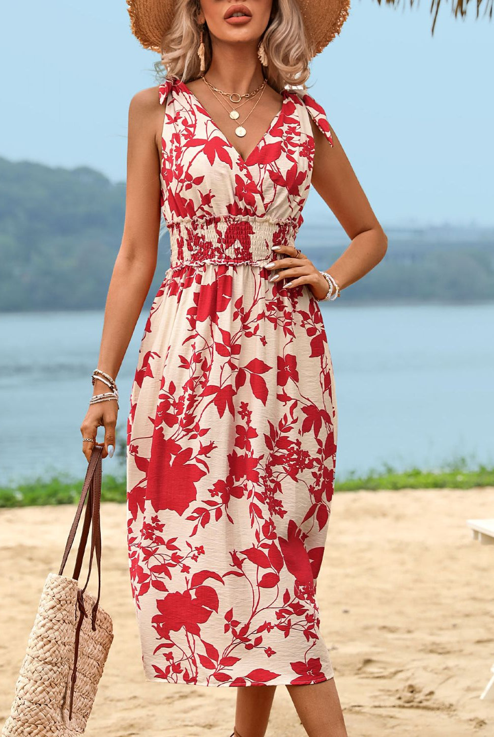 Chic red printed smocked midi dress with a surplice neckline, perfect for summer outings and casual occasions.