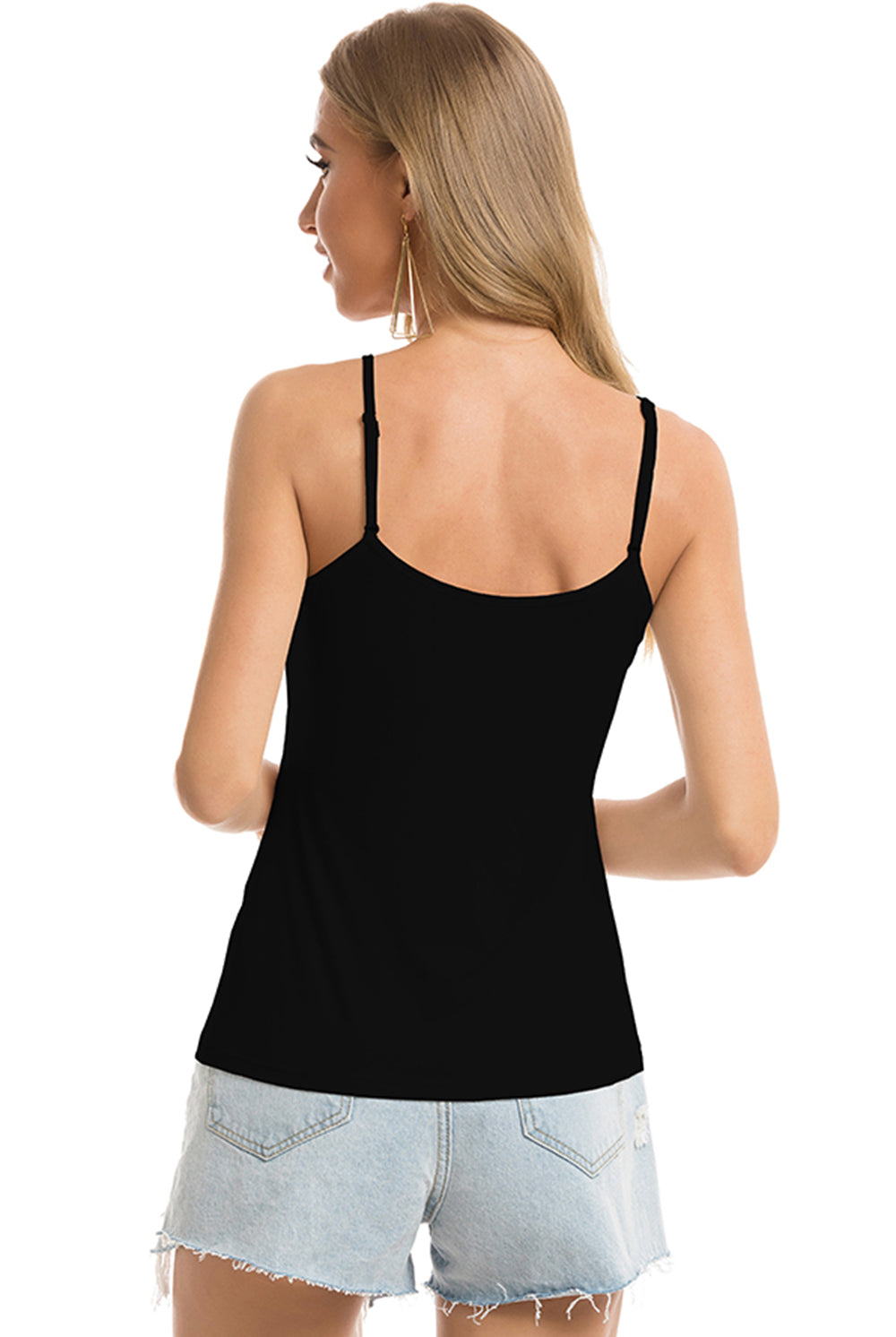Elegant white spaghetti strap camisole top on a model, an essential wardrobe staple for pairing or standalone wear.