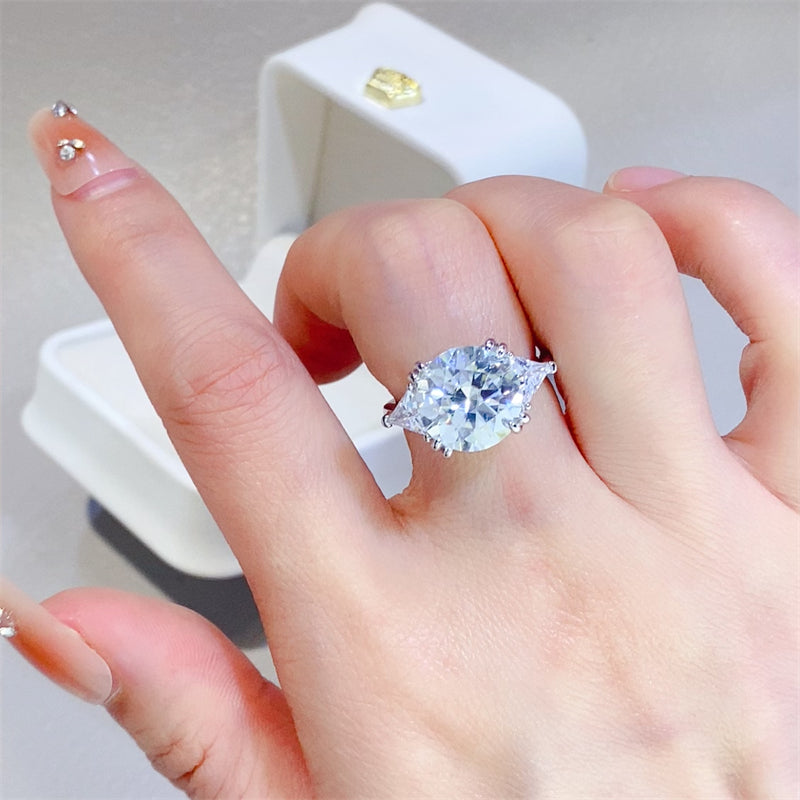 Hand showcasing a luxurious 5 carat Moissanite ring set in sterling silver