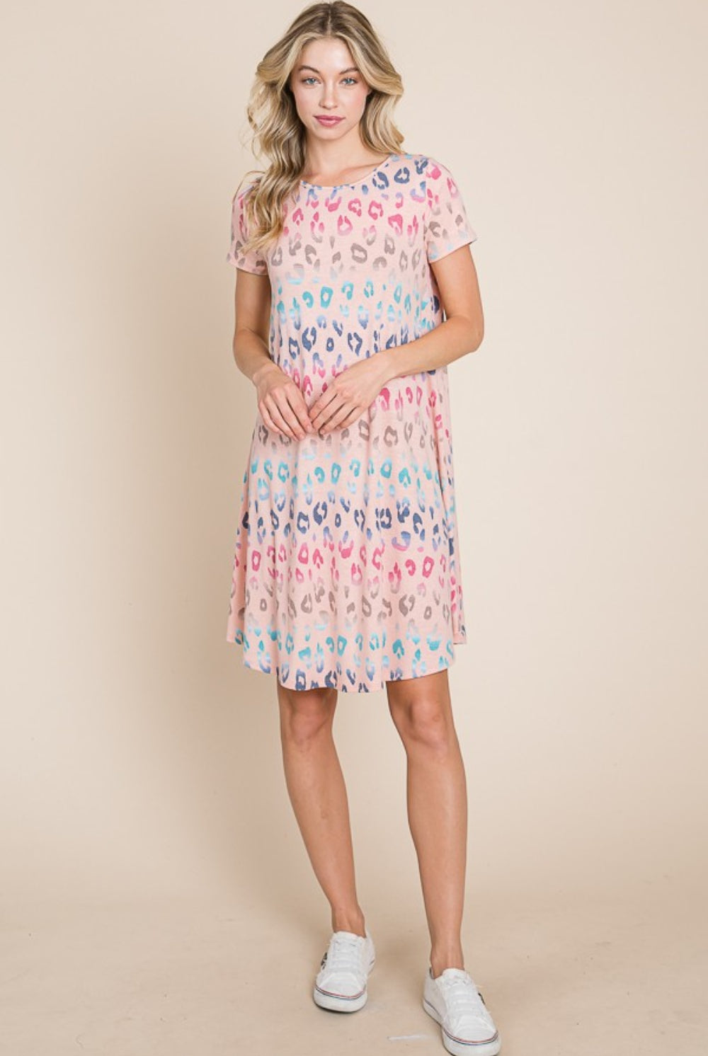Happy woman wearing a Playful Pastel Leopard Print Short Sleeve Dress, embodying a cheerful and stylish vibe, perfect for spring and summer days.
