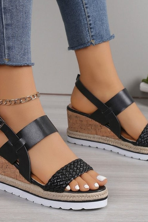 Stylish women's black wedge sandals with woven design, made from PU leather, perfect for vegan enthusiasts.