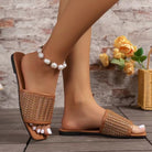Elegant women's woven flat sandals in caramel, perfect for casual wear.