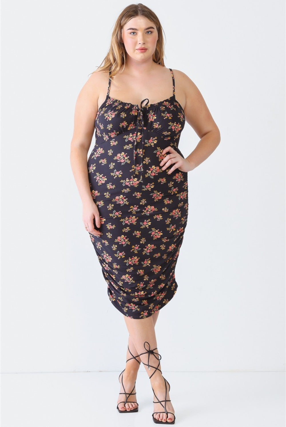 Chic plus size cami dress with a delicate floral pattern, perfect for any occasion.