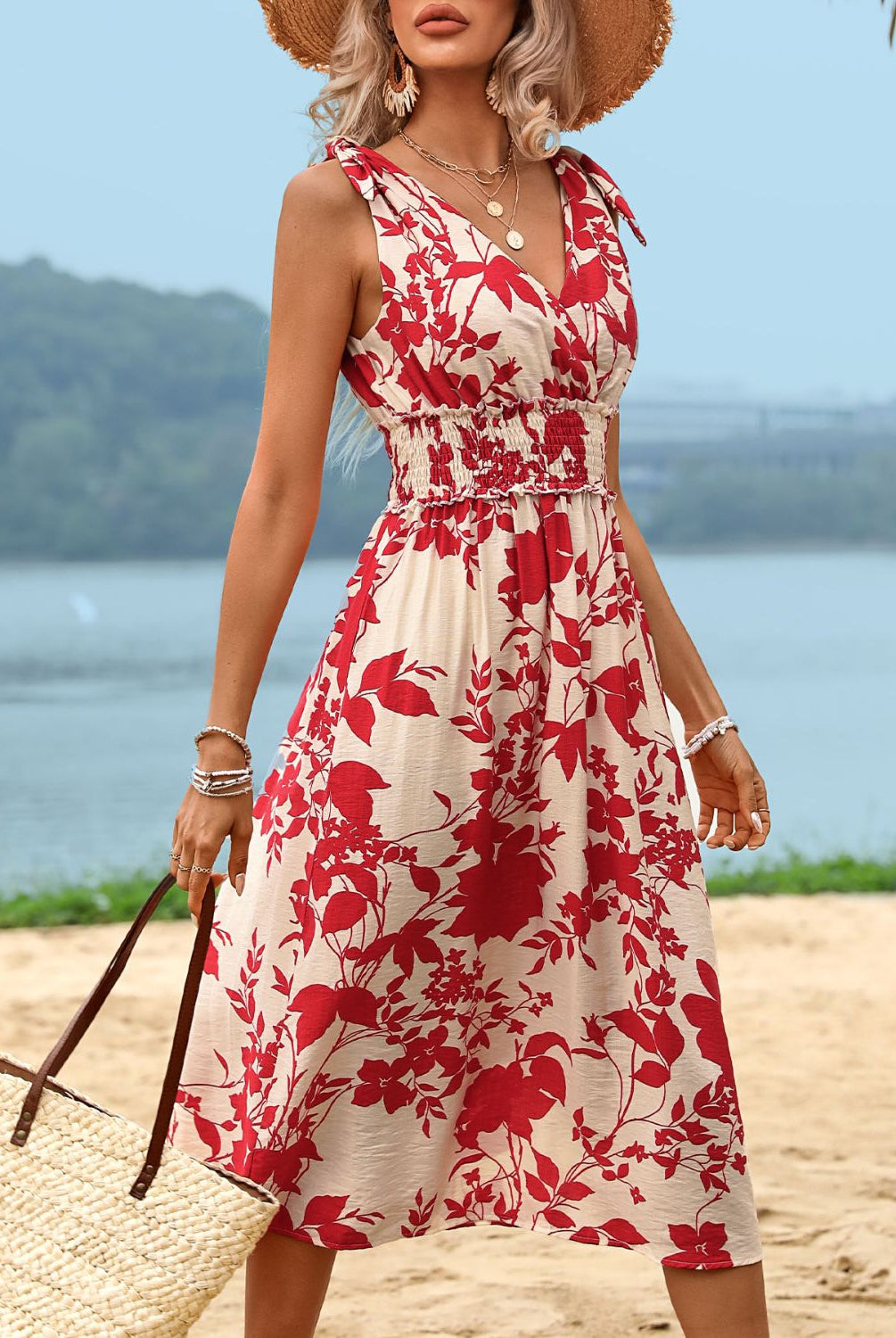 Chic red printed smocked midi dress with a surplice neckline, perfect for summer outings and casual occasions.