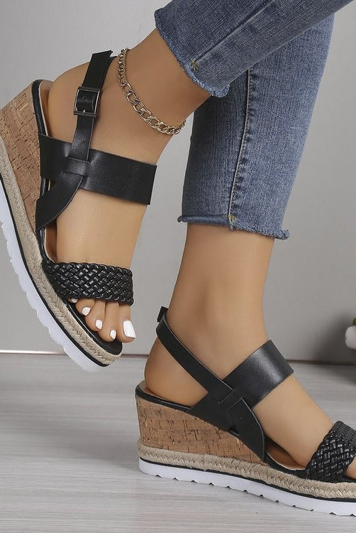 Stylish women's black wedge sandals with woven design, made from PU leather, perfect for vegan enthusiasts.