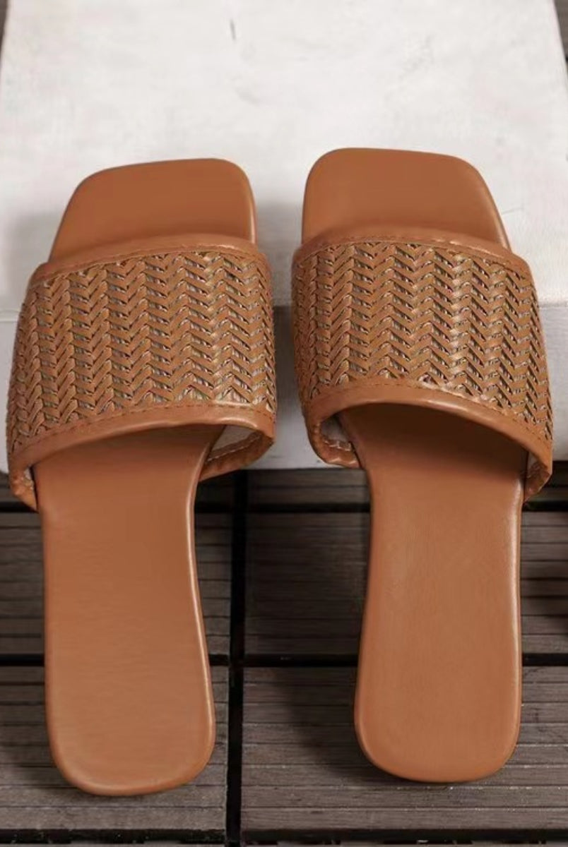 Elegant women's woven flat sandals in caramel, perfect for casual wear.