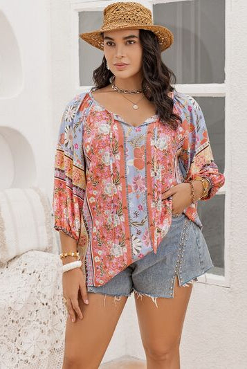 Plus Size Printed Balloon Sleeve Blouse with Tie-Neck: A stylish and comfortable wardrobe essential designed to flatter your curves. The vibrant print, balloon sleeves, and tie-neck detail add a touch of sophistication. Available at GemThreads Boutique.